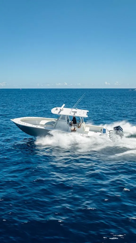 Slide: The Image of 2025 Billfish 39 Center Console boat cruising on open ocean. - 42
