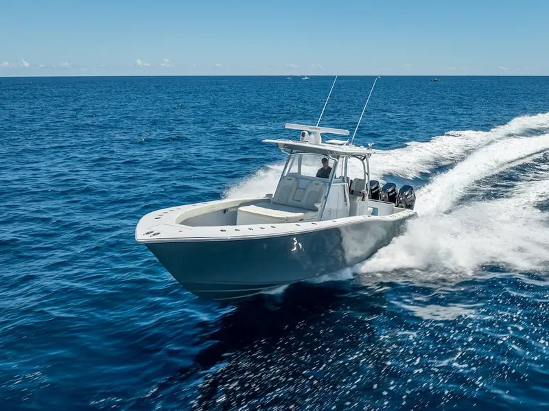 Slide: The Image of 2025 Billfish 39 Center Console boat cruising on open ocean. - 45
