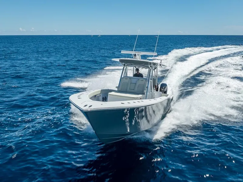 Slide: The Image of 2025 Billfish 39 Center Console boat cruising on open ocean. - 46