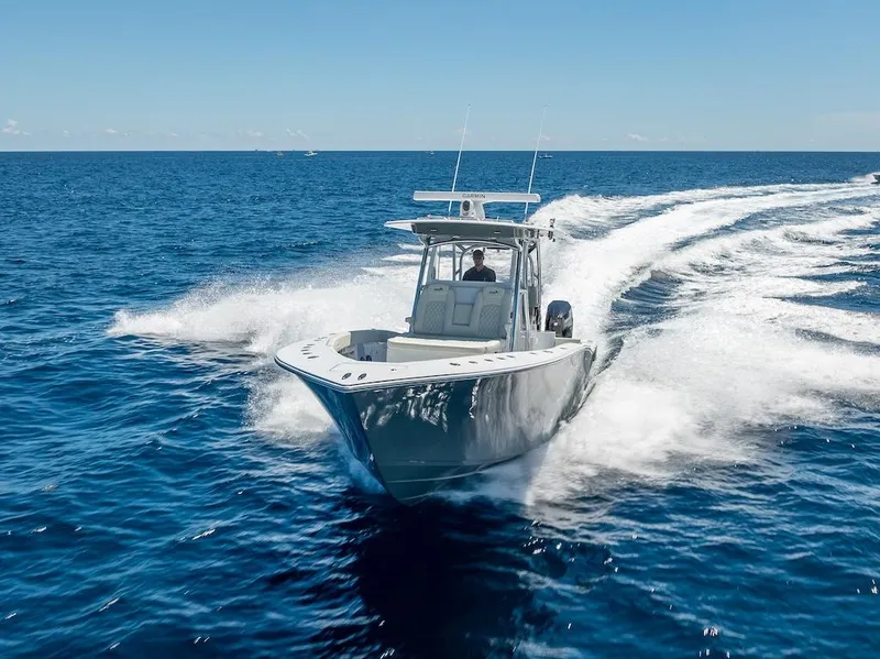 Slide: The Image of 2025 Billfish 39 Center Console boat cruising on open ocean. - 47