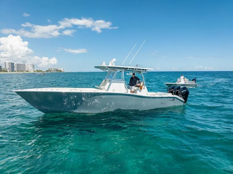 Slide: The Image of 2025 Billfish 39 Center Console boat on clear blue ocean. - 7