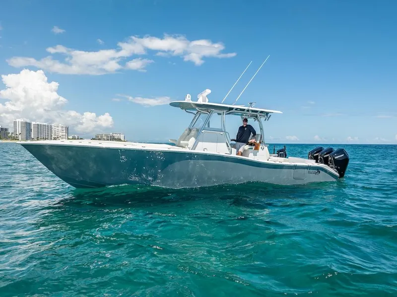 Slide: The Image of 2025 Billfish 39 Center Console boat on clear blue water. - 8