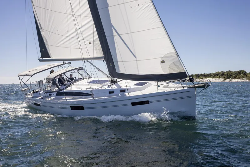 Slide: The Image of Sailing yacht Catalina 426, 2025 model, gliding on open water under clear skies. - 13