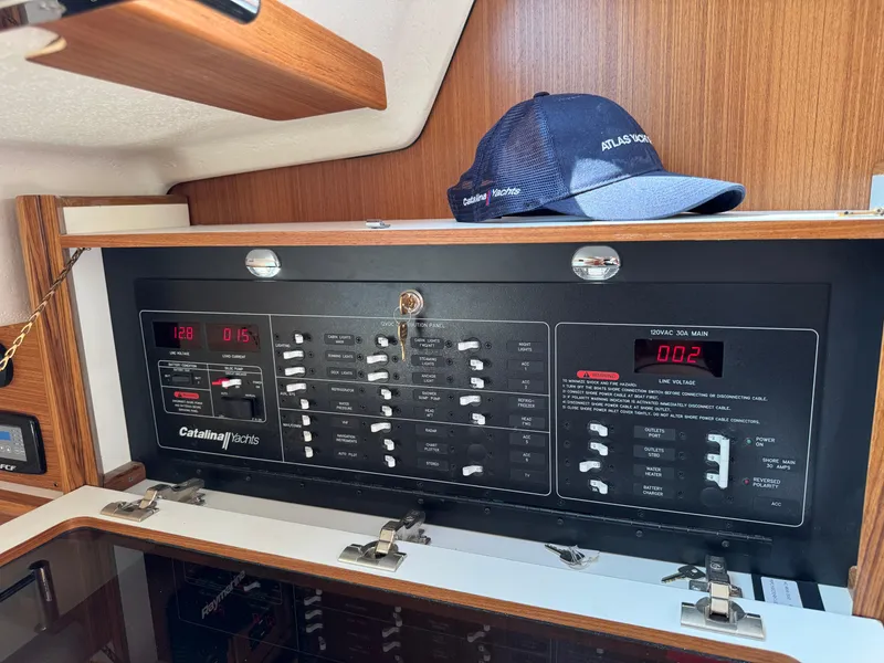 Slide: The Image of Electrical panel of 2025 Catalina 426 yacht with control switches and digital displays. - 31