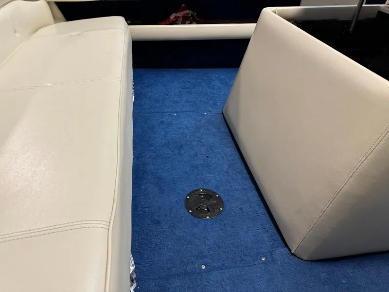 Slide: The Image of 1998 Century Coronado interior with blue carpet and beige seating. - 30