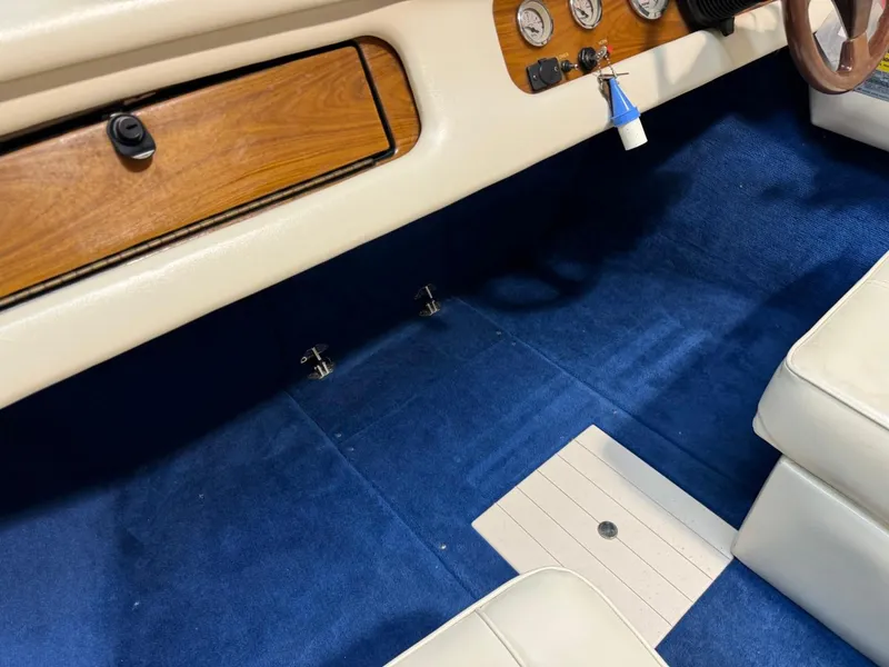 Slide: The Image of 1998 Century Coronado interior with blue carpet and wood accents. - 32