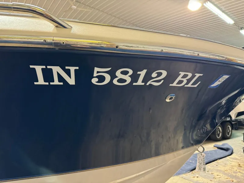 Slide: The Image of 1998 Century Coronado boat with registration number IN 5812 BL in a garage. - 35