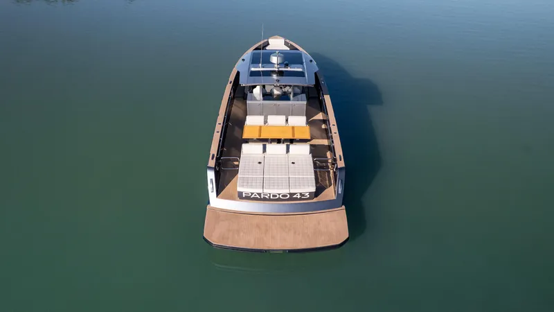 Slide: The Image of 2025 Pardo Yachts P43 luxury yacht on calm water, aerial view. - 10