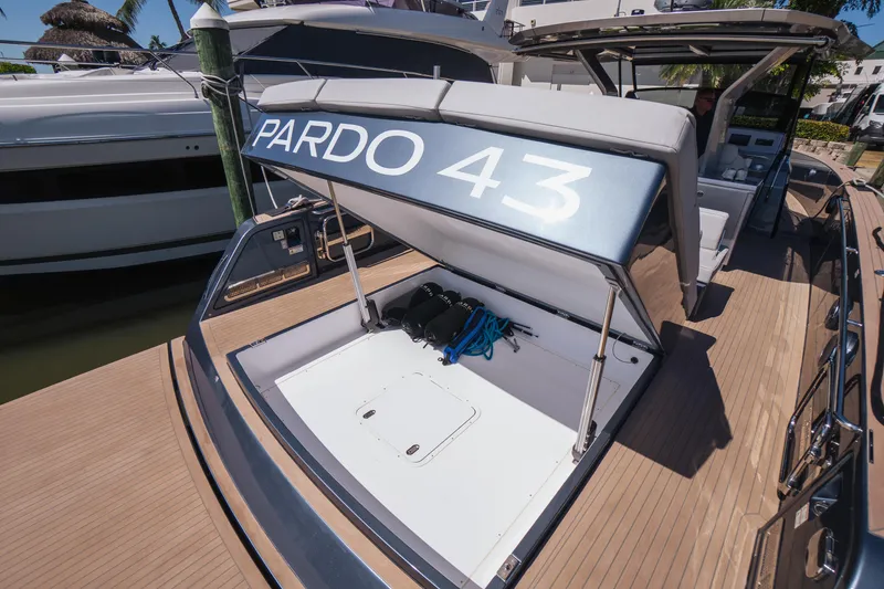 Slide: The Image of 2025 Pardo Yachts P43 luxury yacht with open storage compartment at dock. - 20