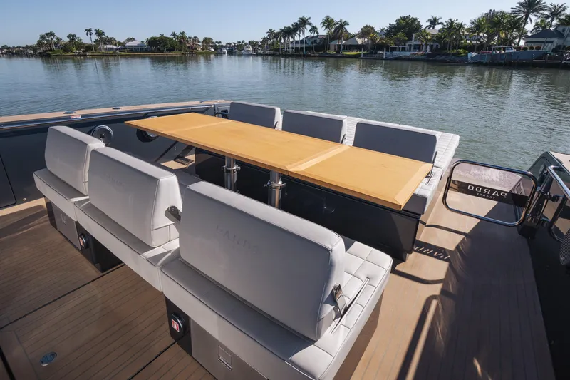 Slide: The Image of Luxury seating area on 2025 Pardo Yachts P43, overlooking serene waterfront. - 22