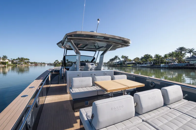 Slide: The Image of 2025 Pardo Yachts P43 luxury yacht with spacious deck and seating, cruising on calm waters. - 25