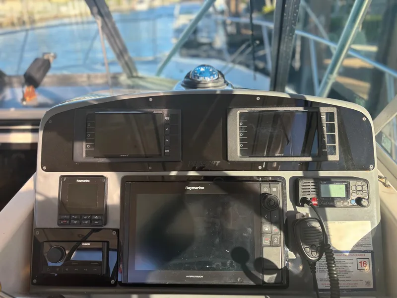Slide: The Image of Control panel of 2000 Pursuit 3400 Express boat with navigation equipment. - 10
