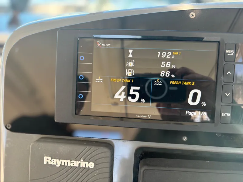Slide: The Image of Raymarine display on 2000 Pursuit 3400 Express, showing engine hours and tank levels. - 13