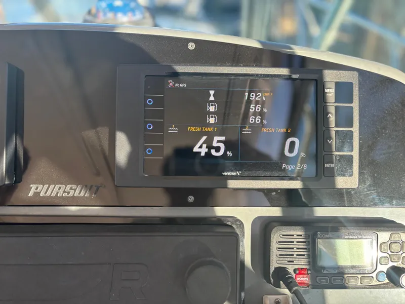 Slide: The Image of Dashboard of 2000 Pursuit 3400 Express w/ Tower, showing fuel and system gauges. - 15