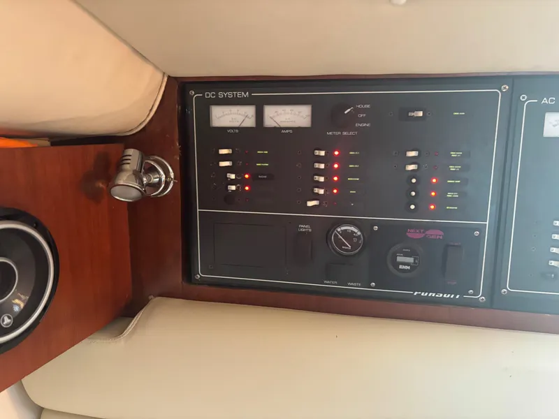 Slide: The Image of Control panel of 2000 Pursuit 3400 Express boat, featuring DC system indicators. - 25