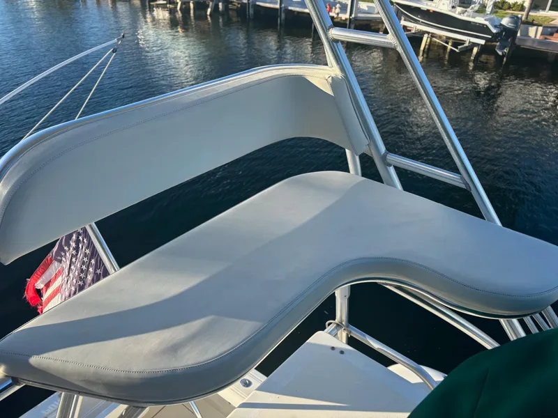 Slide: The Image of Pursuit 3400 Express 2000 boat tower seat with marina view. - 7