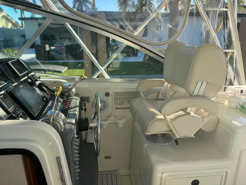 Slide: The Image of Interior of 2000 Pursuit 3400 Express boat with helm and captain's chair. - 8