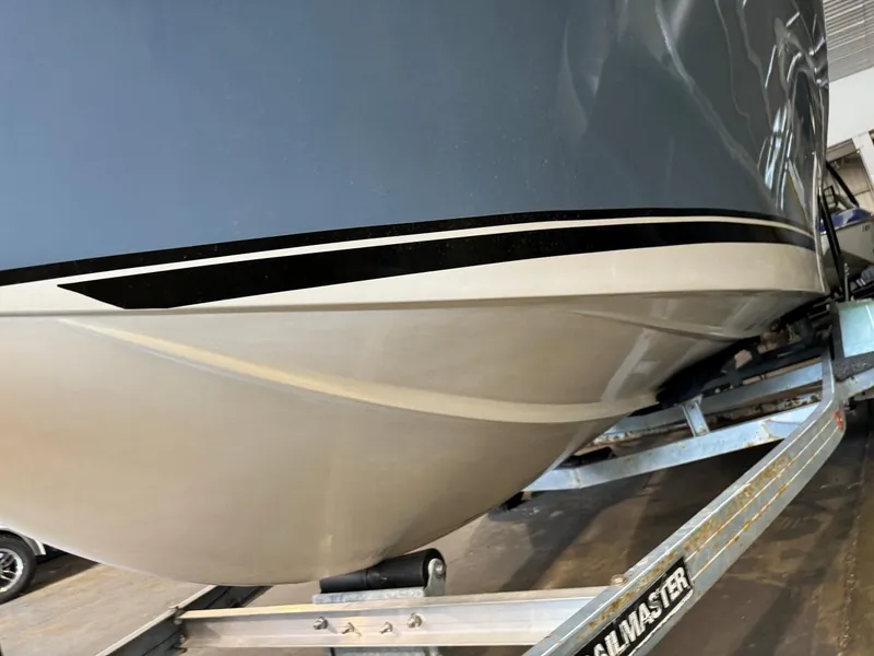 Slide: The Image of 1985 Coronado Cardel boat on trailer, showcasing sleek hull design. - 10