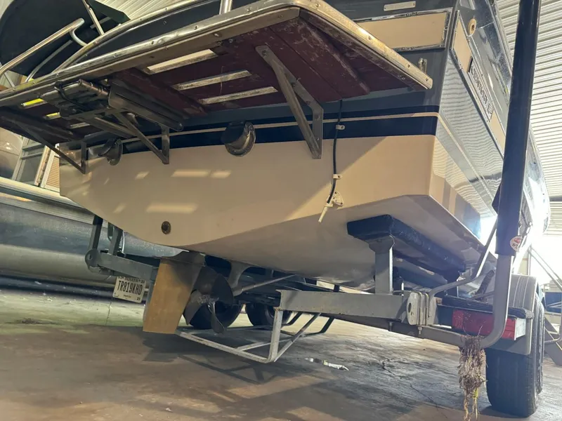 Slide: The Image of 1985 Coronado Cardel boat on trailer in storage facility. - 12