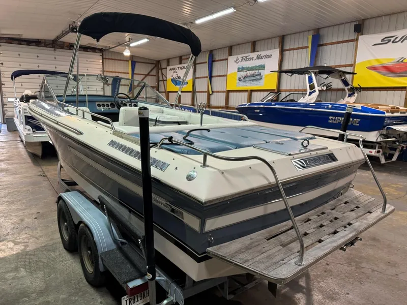 Slide: The Image of 1985 Coronado Cardel boat on trailer in indoor storage facility. - 20