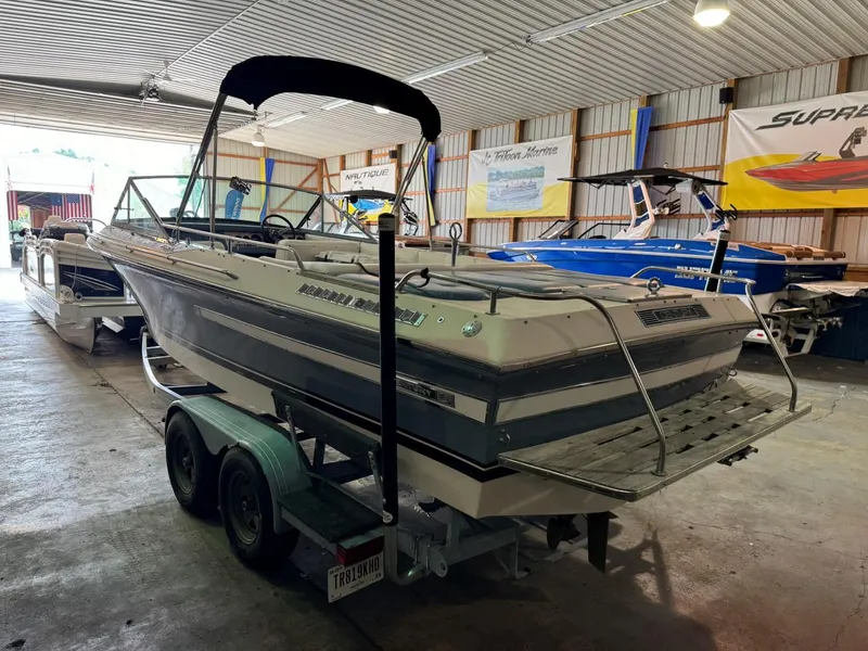 Slide: The Image of 1985 Coronado Cardel boat on trailer in indoor storage facility. - 5
