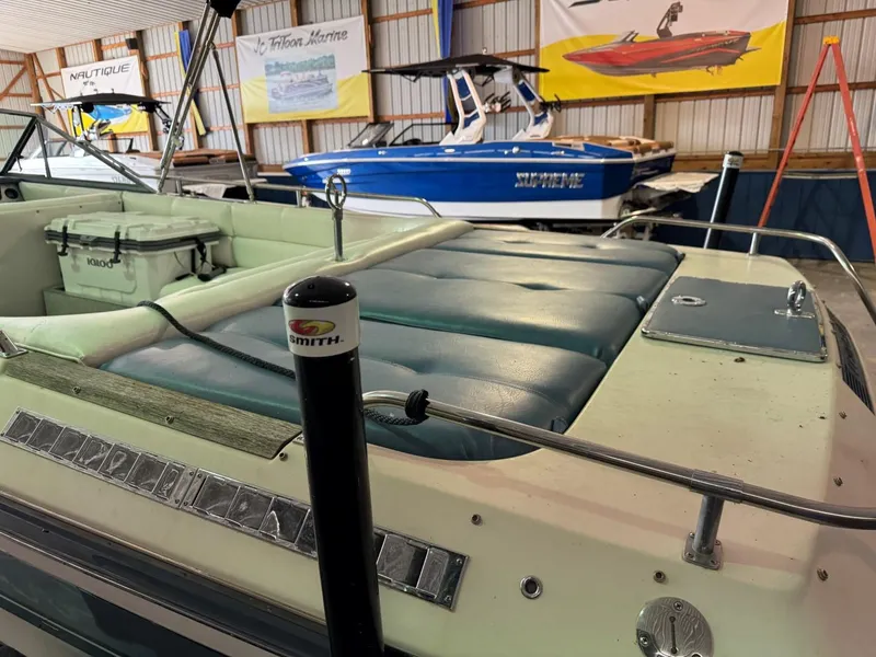 Slide: The Image of 1985 Coronado Cardel boat interior in a showroom with other boats. - 6