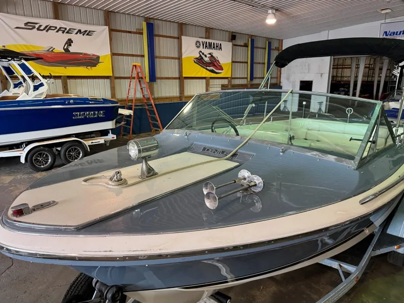 Slide: The Image of 1985 Coronado Cardel boat in showroom, featuring sleek design and vintage style. - 8