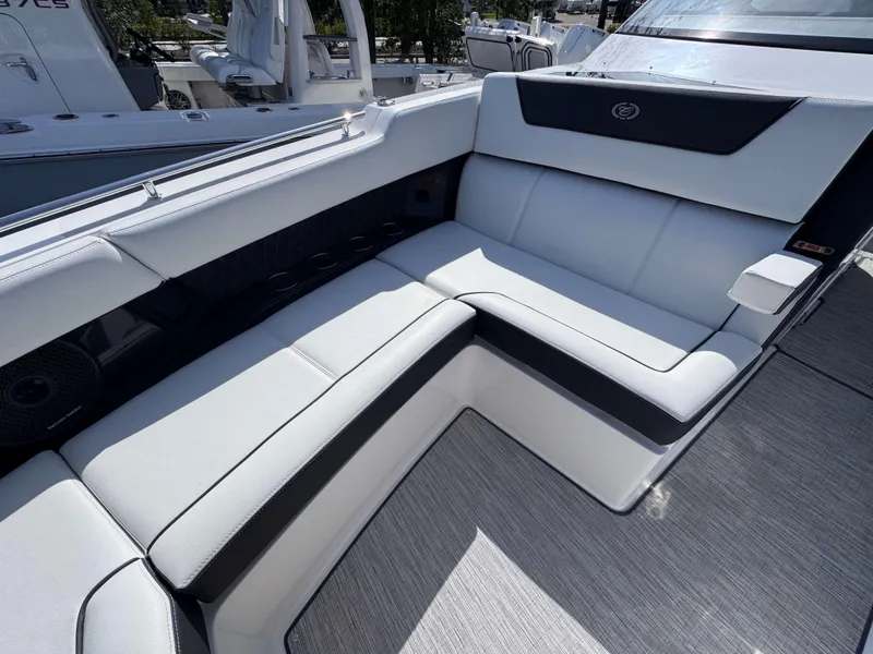 Slide: The Image of Luxurious seating on 2025 Cobalt R35 boat, featuring sleek white and black upholstery. - 11