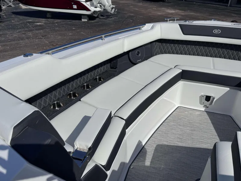 Slide: The Image of Luxurious seating area on 2025 Cobalt R35 boat with cup holders and stylish upholstery. - 12