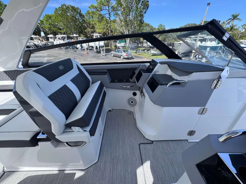Slide: The Image of 2025 Cobalt R35 boat interior with modern helm and seating. - 13