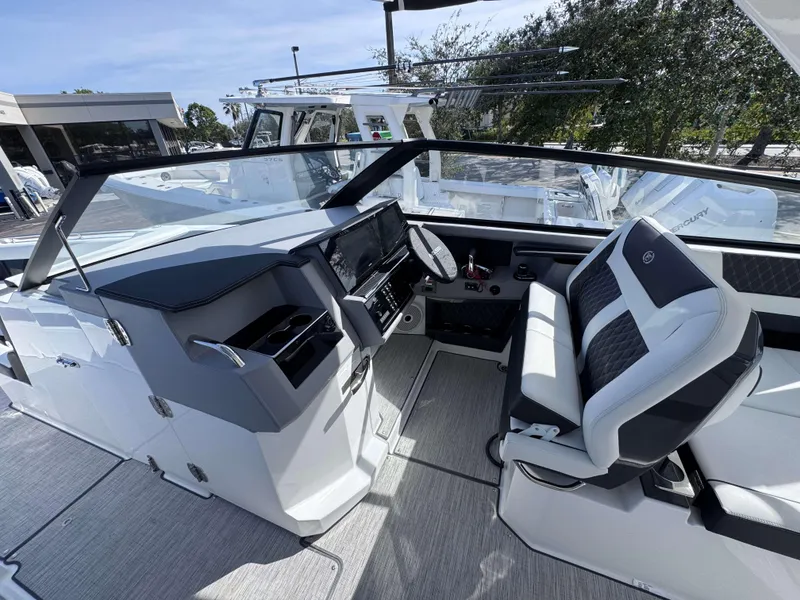 Slide: The Image of Cobalt R35 2025 boat interior with modern dashboard and comfortable seating. - 14