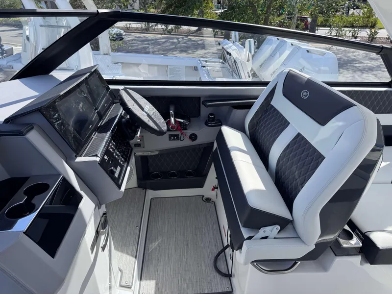 Slide: The Image of 2025 Cobalt R35 boat interior with modern dashboard and luxurious seating. - 15