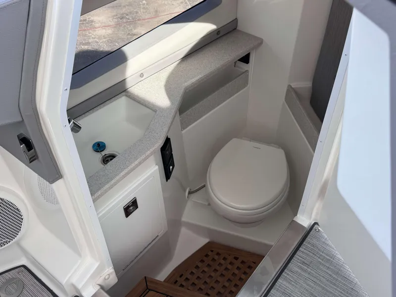 Slide: The Image of 2025 Cobalt R35 boat interior bathroom with sink and toilet. - 18