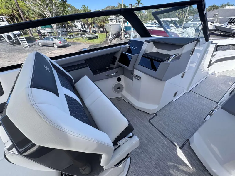 Slide: The Image of Interior of 2025 Cobalt R35 boat with modern seating and dashboard. - 21