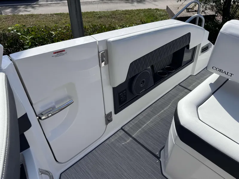 Slide: The Image of 2025 Cobalt R35 boat interior with speaker and seating area. - 27