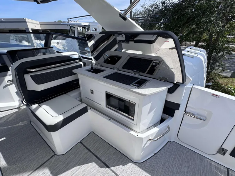 Slide: The Image of Luxurious interior of 2025 Cobalt R35 boat with modern seating and kitchenette. - 29