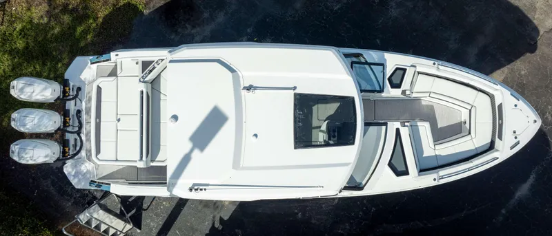 Slide: The Image of Aerial view of 2025 Cobalt R35 boat with triple outboard engines. - 3