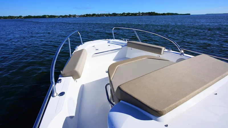 Slide: The Image of Nimbus T9 #165 boat, 2025 model, with beige seating on open water. - 12
