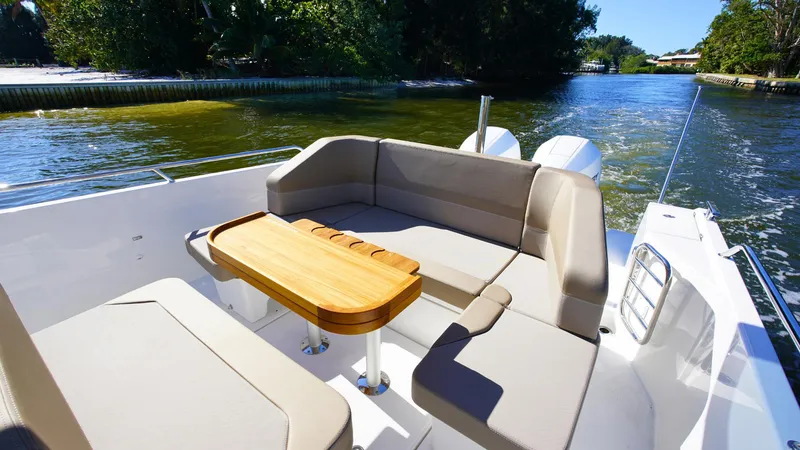 Slide: The Image of Luxurious Nimbus T9 #165 boat interior, 2025 model, with elegant seating and wooden table. - 17