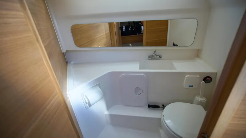 Slide: The Image of Compact bathroom in 2025 Nimbus T9 #165 boat with modern fixtures and mirror. - 21