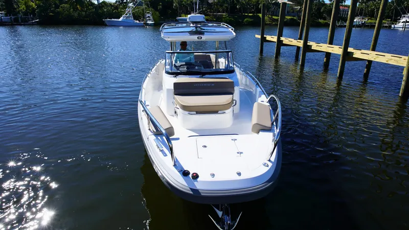 Slide: The Image of Nimbus T9 #165 boat on calm water, 2025 model, docked near a pier. - 4