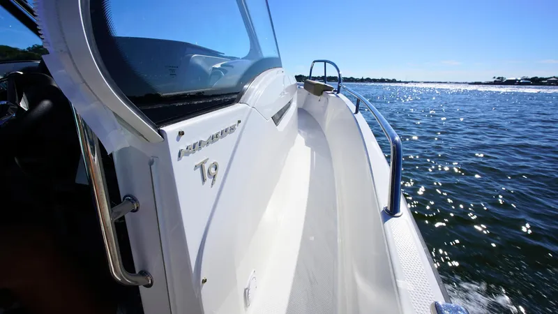 Slide: The Image of Nimbus T9 #165 boat cruising on sunny waters, 2025 model. - 6