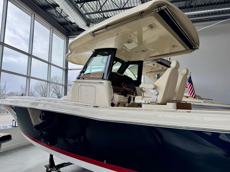 Slide: The Image of 2022 Chris-Craft Catalina 30 boat in showroom, featuring sleek design and modern amenities. - 29