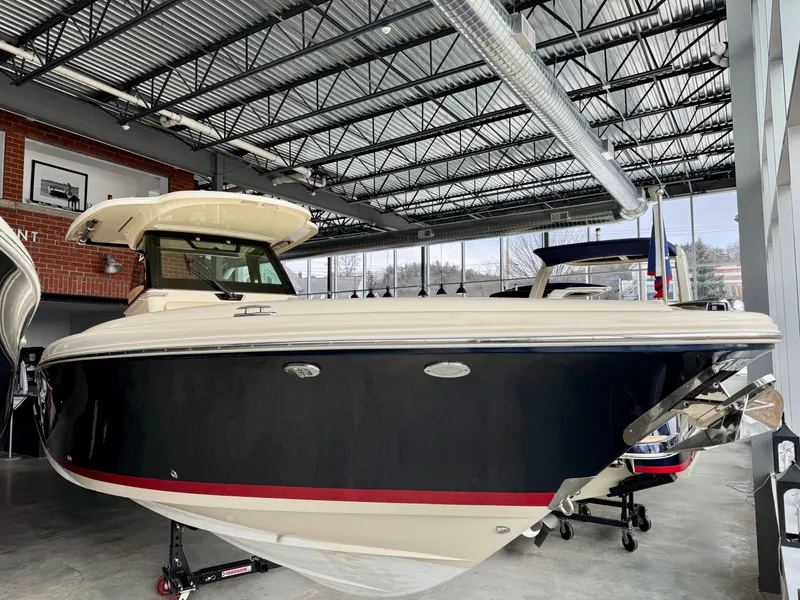 Slide: The Image of 2022 Chris-Craft Catalina 30 boat displayed indoors, showcasing sleek design and craftsmanship. - 30