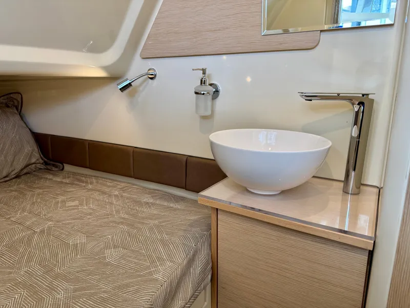 Slide: The Image of 2022 Chris-Craft Catalina 30 cabin interior with bed and modern sink. - 35