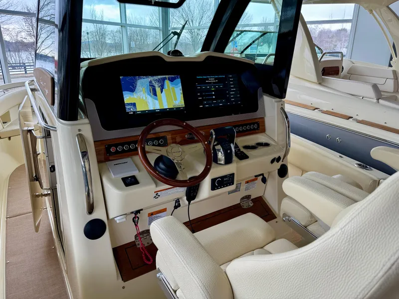 Slide: The Image of 2022 Chris-Craft Catalina 30 helm with advanced navigation system and luxurious seating. - 38