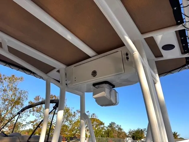 Slide: The Image of Tidewater 210 LXF 2022 boat T-top with storage compartment and speaker. - 16