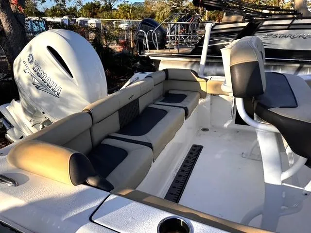 Slide: The Image of 2022 Tidewater 210 LXF boat interior with Yamaha engine, featuring comfortable seating. - 8