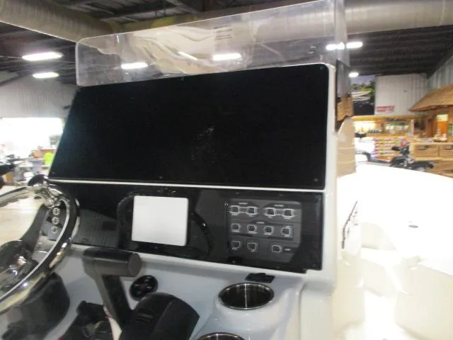 Slide: The Image of 2025 Skeeter SX2350 boat dashboard with steering wheel and control panel. - 10