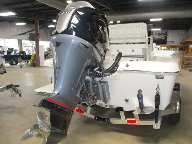 Slide: The Image of 2025 Skeeter SX2350 boat with powerful outboard motor in showroom. - 11